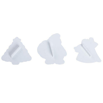 Three white plastic fondant cutters on a white background