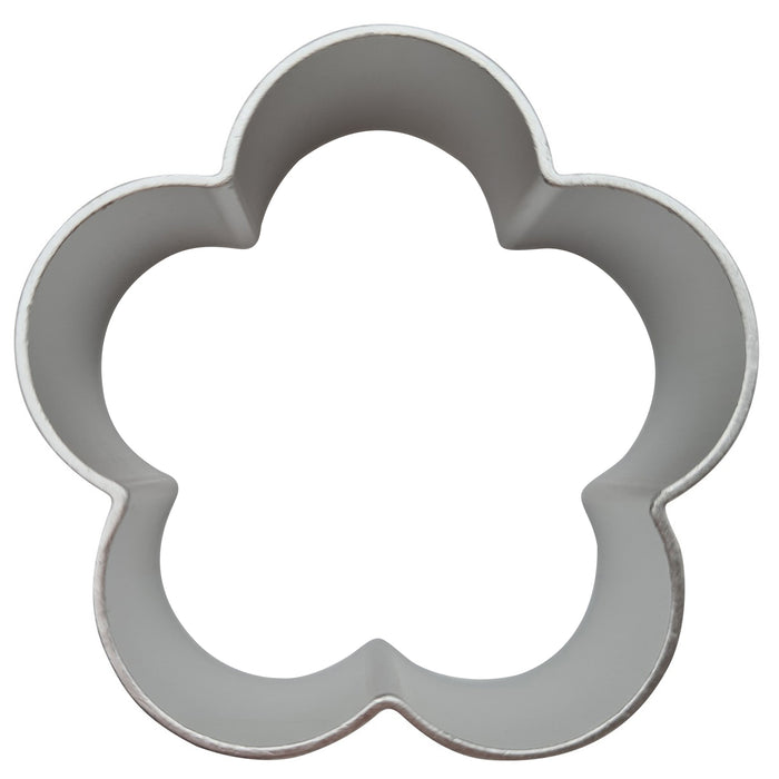 Flower-shaped cookie cutter on a white background