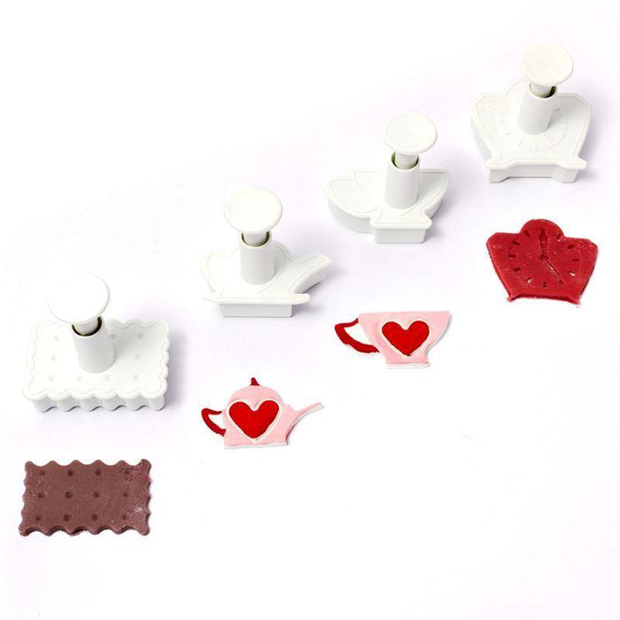 Set of white fondant plunger cutters with various shapes on a white background