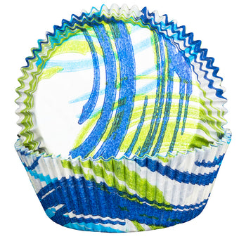 Colorful cupcake liner with blue, green, and white pattern on a white background