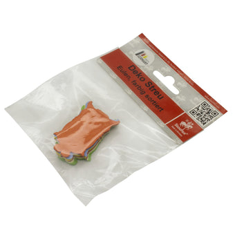 Packaged owl shaped cake toppers on a white background