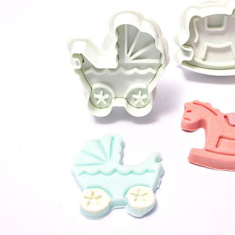 Set of plunger cutters shaped like a rocking horse and pram on a white background.