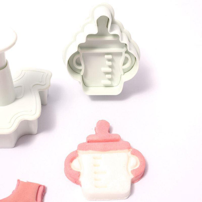 Bottle-shaped plunger cutters on a white background