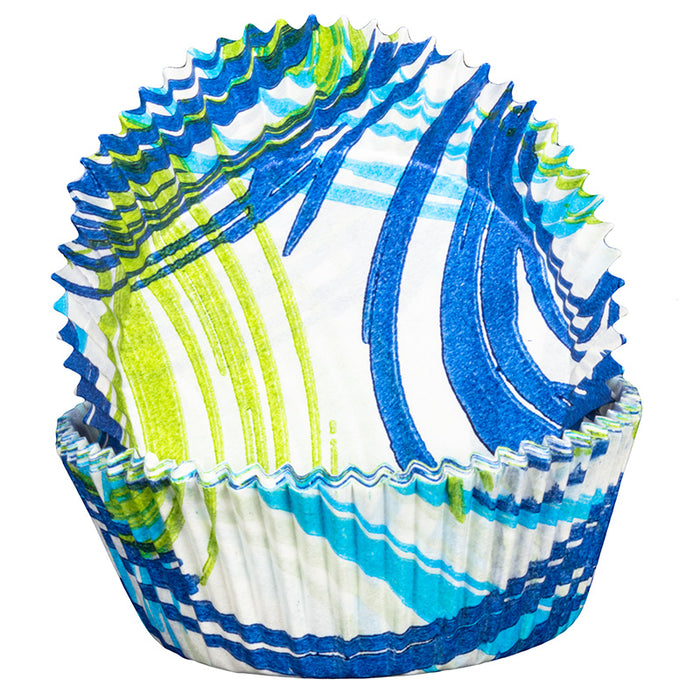Decorative cupcake liner with blue, green, and white wave pattern on a white background