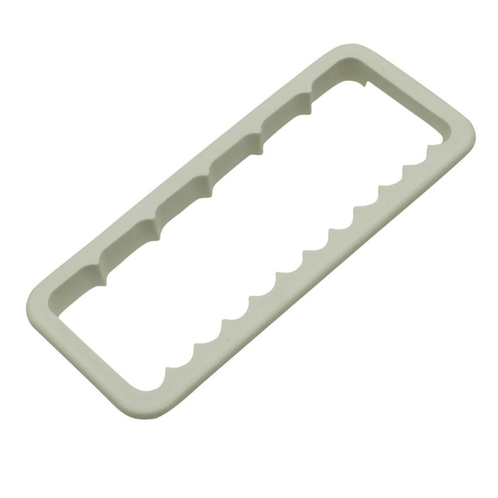 White plastic wavy and ribbed edge cutter on a white background