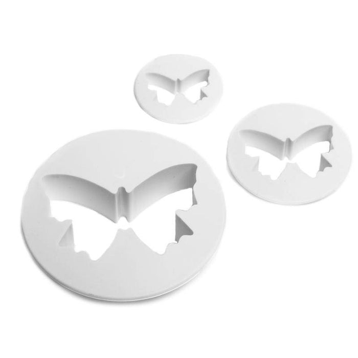 Set of butterfly-shaped fondant cutters on a white background