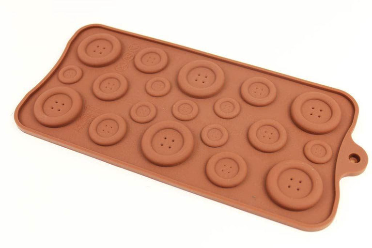 Brown silicone button mould showing small, medium and large button shapes