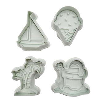 Set of four plunger cutters shaped like a sailboat, palm tree, and Ice cream and bucket and spade on a white background.