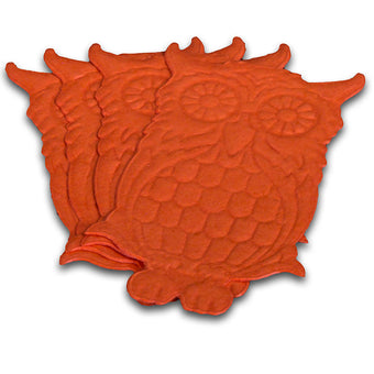 Set of orange owl-shaped cake toppers on a white background