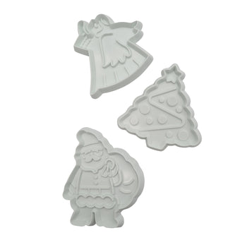 Three fondant cutters shaped like a Angel, Tree and Santa on a white background