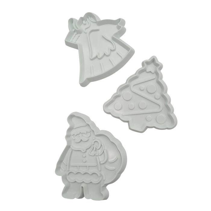Three fondant cutters shaped like a Angel, Tree and Santa on a white background