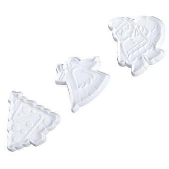 Set of white Christmas-themed fondant cutters on a white background
