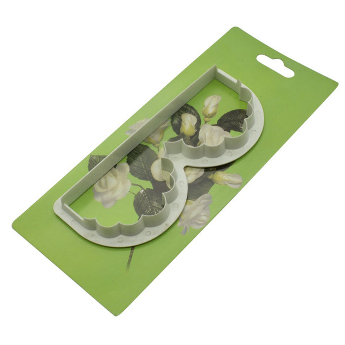 White plastic wavy design edge cutter in packaging on a white background