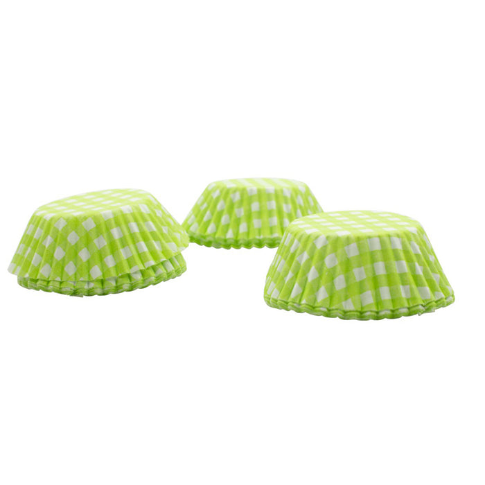 Green checkered cupcake liners on a white background