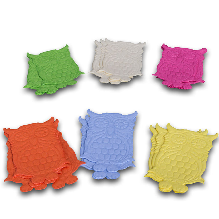 Set of owl-shaped cake toppers in different colours on a white background
