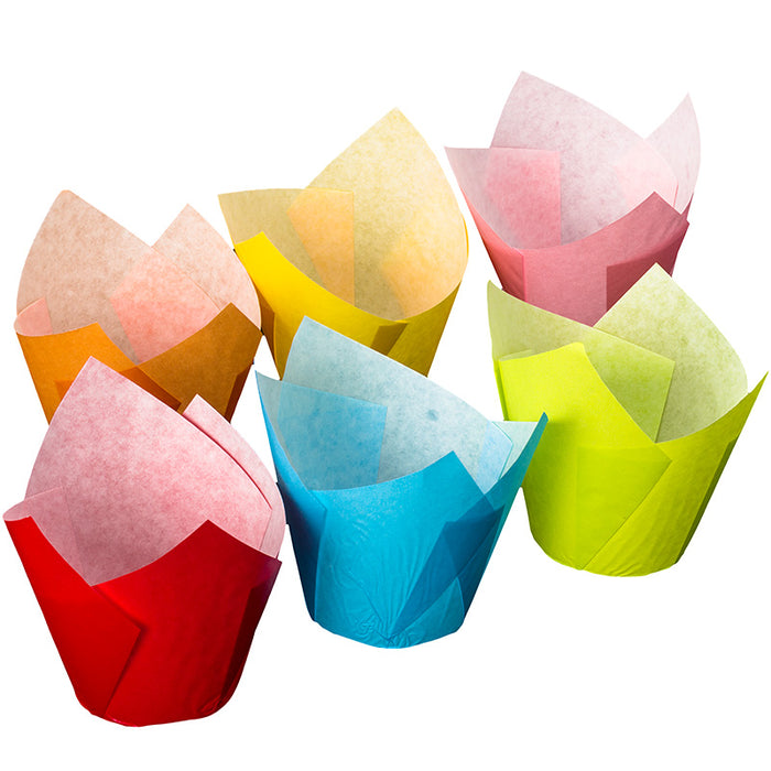 Set of colorful tulip-shaped paper muffin cups on a white background