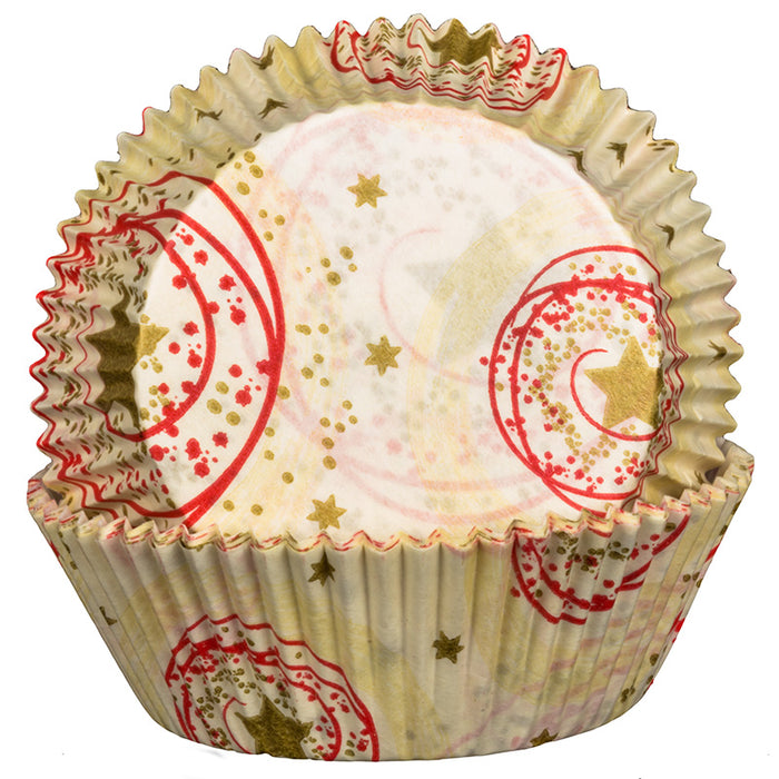 Decorative cupcake liner with red and gold patterns on a white background