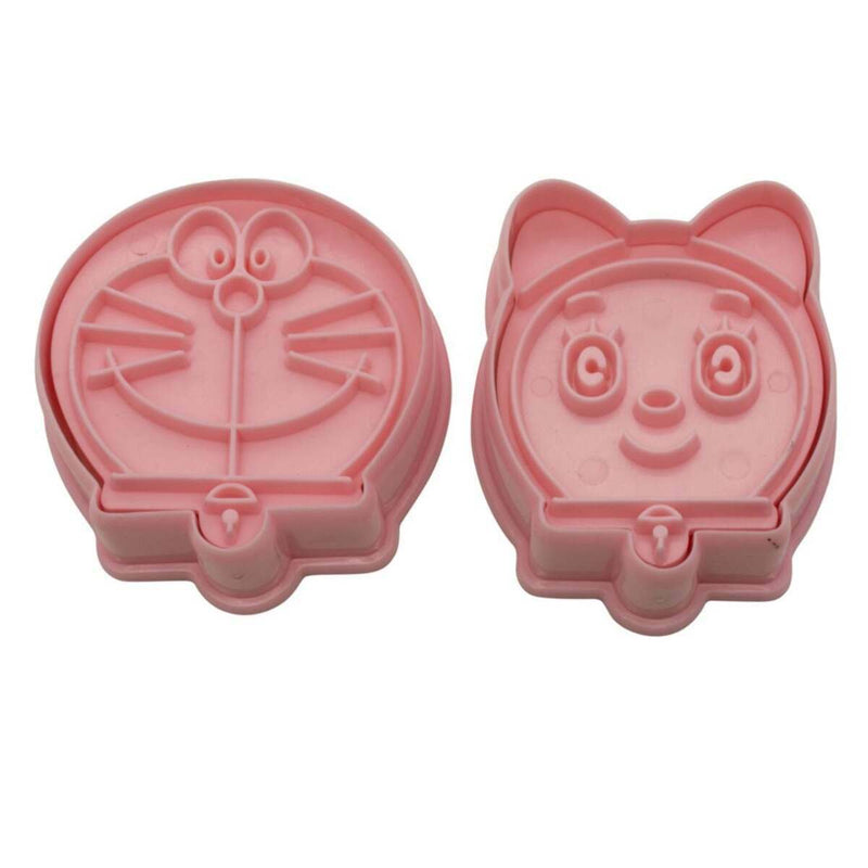 Two pink cartoon character face plunger cutters on a white background
