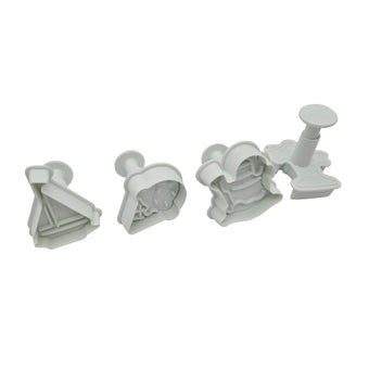 Set of four white plunger cutters on a white background