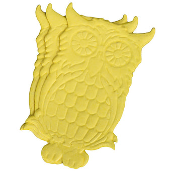Yellow owl-shaped cake topper on a white background
