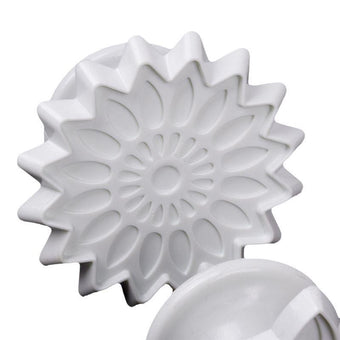White floral pattern fondant veiner on a white background