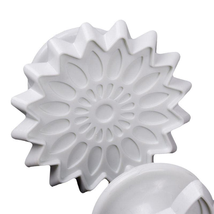 White floral pattern fondant veiner on a white background