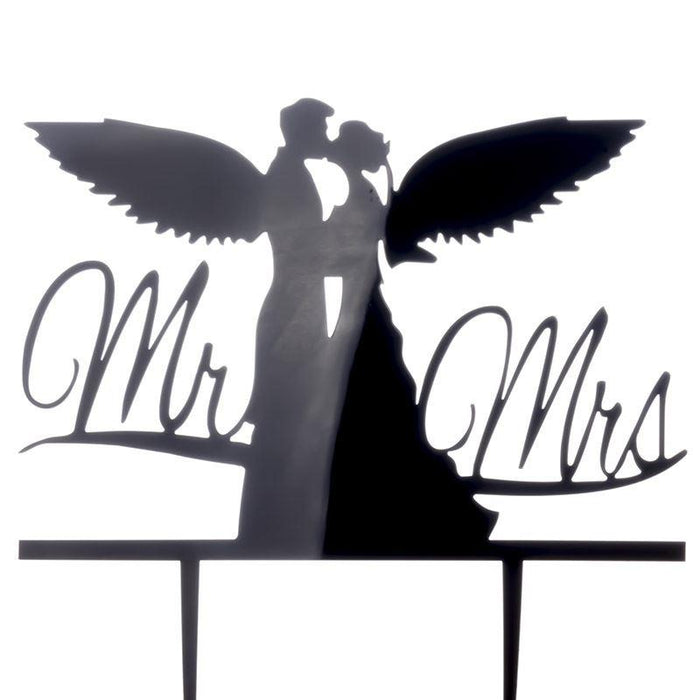 Decorative cake topper with 'Mr' and 'Mrs' and a couple silhouette with wings on a white background