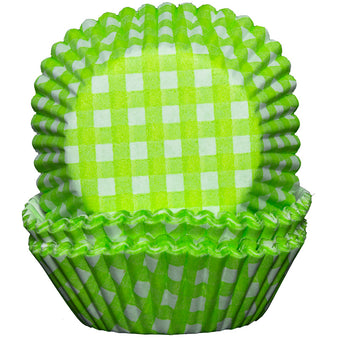 Green and white checkered cupcake liner on a white background