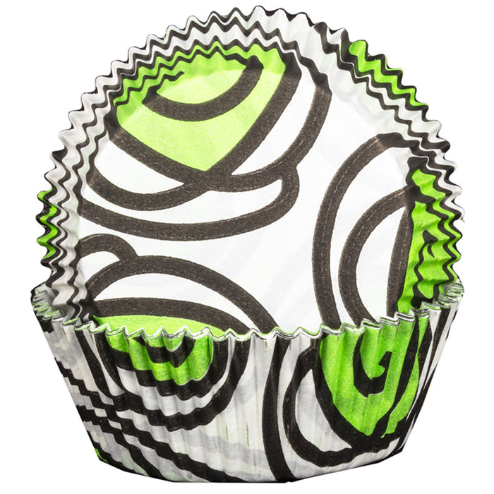 Cupcake liner with black and green abstract design on a white background