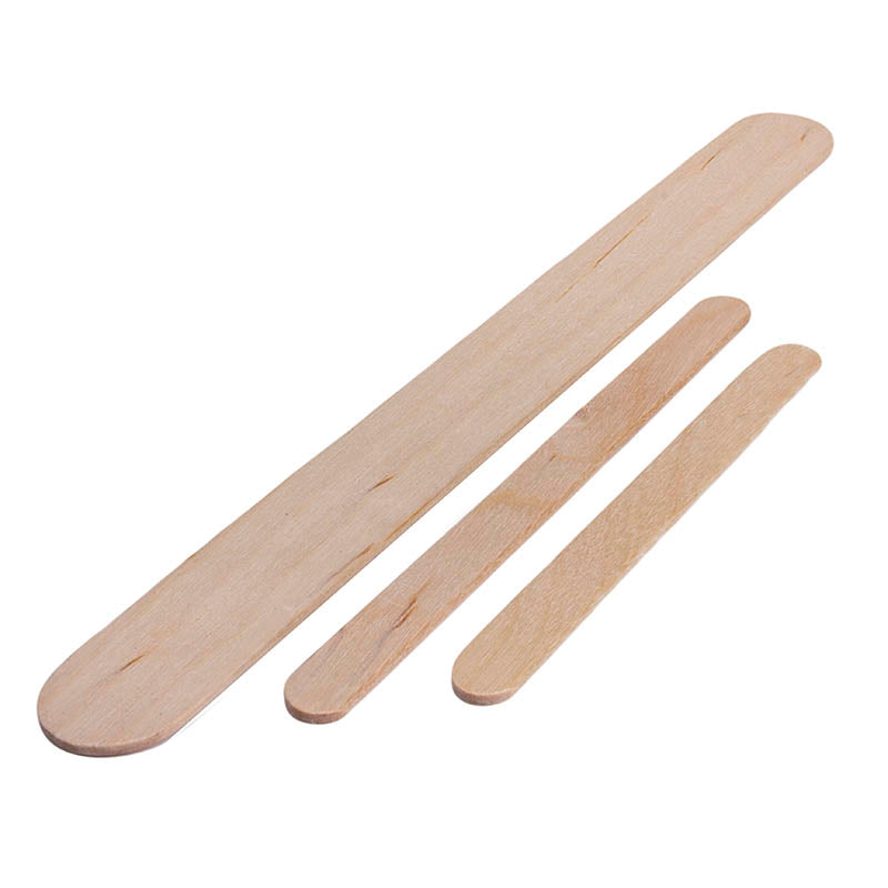Three wooden popsicle sticks of different lengths on a white background