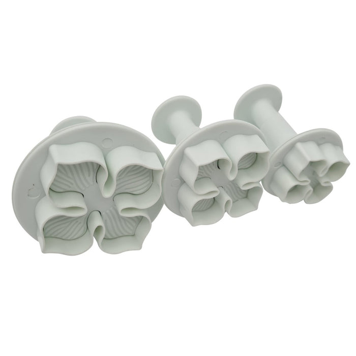 Set of three floral-shaped plunger cutters on a white background