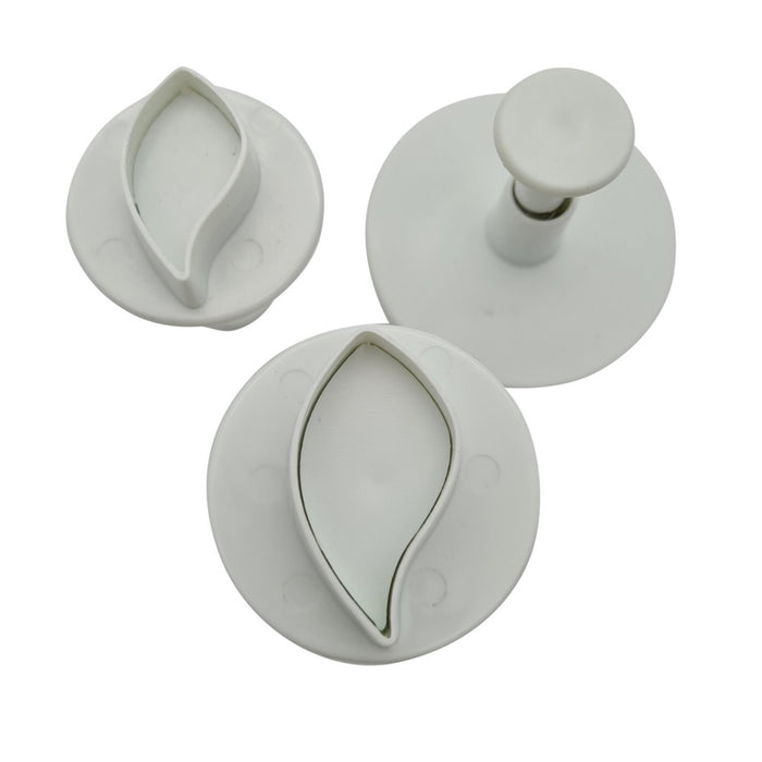 Three white plastic plunger cutters on a white background