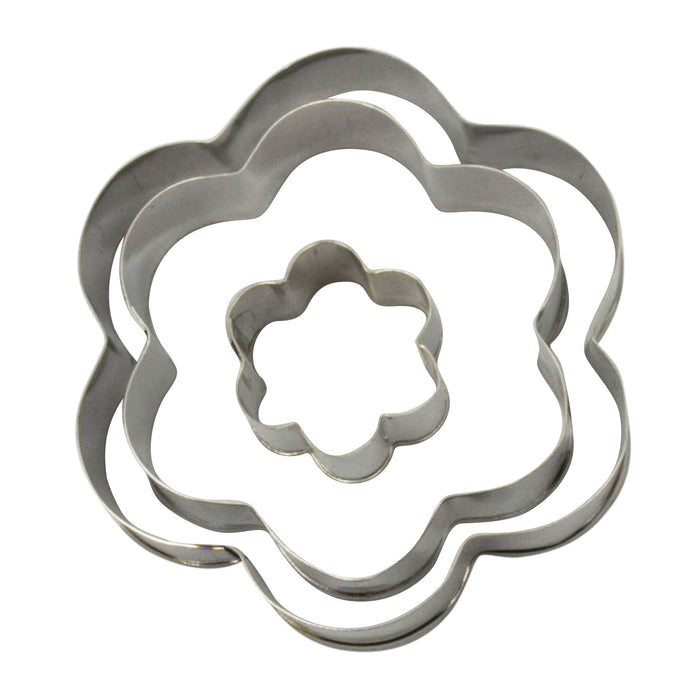 Set of metal flower-shaped fondant cutters on a white background