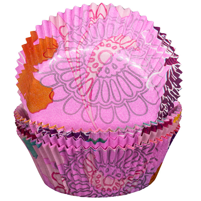 Decorative pink cupcake liners with floral patterns on a white background