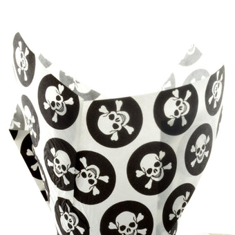 White and black paper cupcake cases with black skull and crossbones pattern on a white background