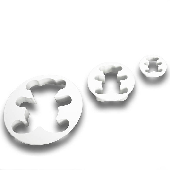 Set of white plastic fondant cutters shaped like teddy bears on a white background