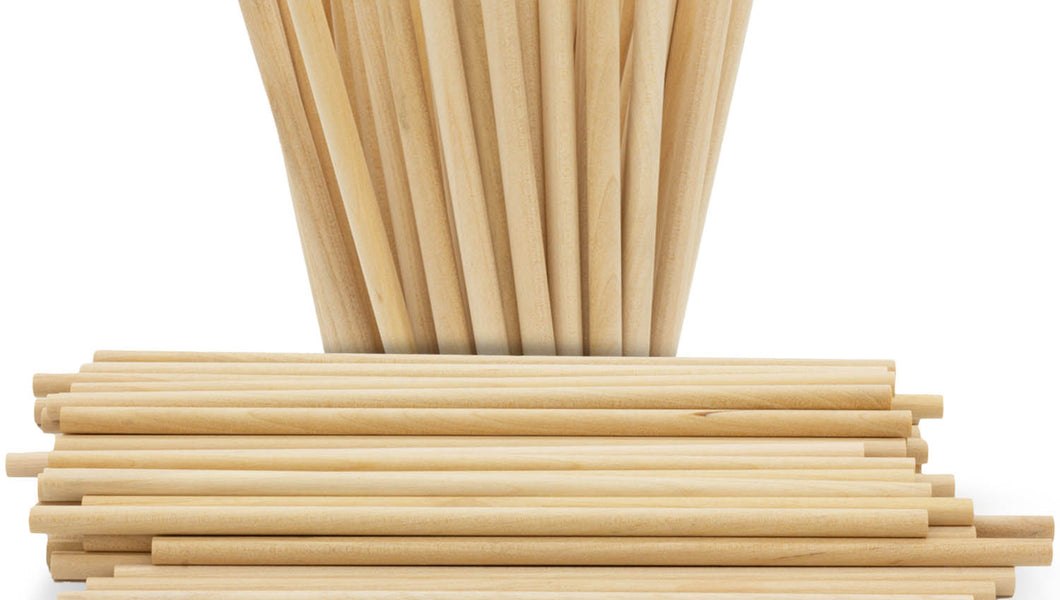 Round wooden lollipop sticks loose showing size variety for cake pops and lollipops on a white background