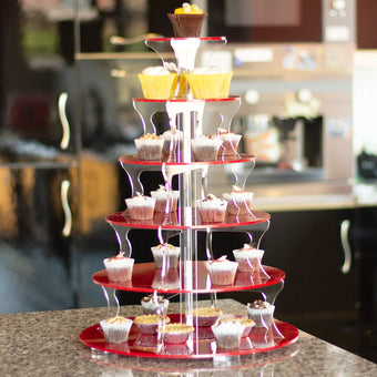 Cupcake tower with various cupcakes on a blurred background