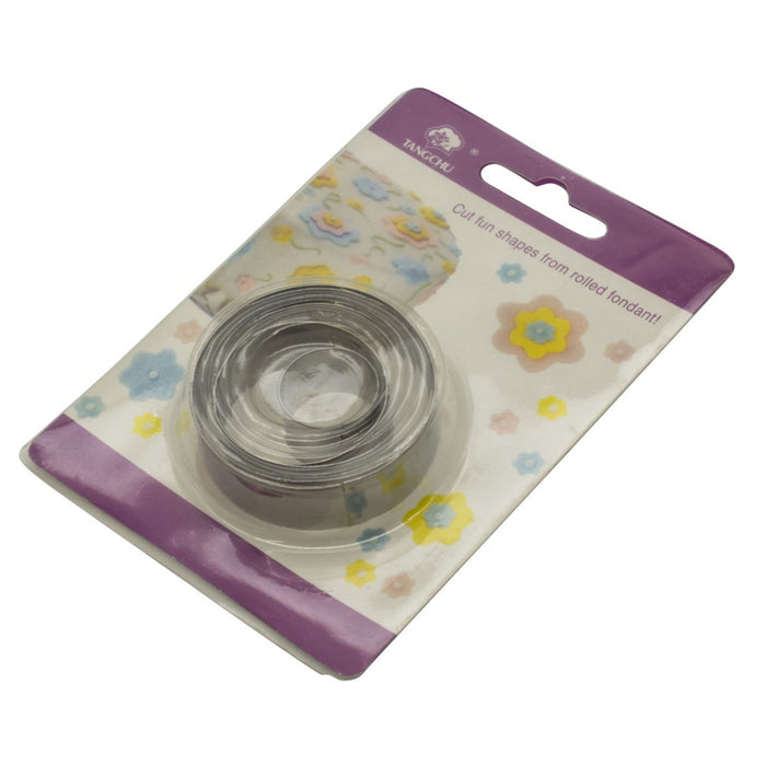 Clear metal circle fondant cutters on a floral-patterned card with a purple border