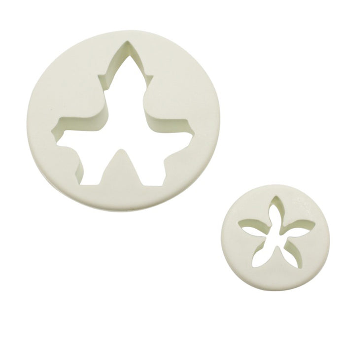 Two white fondant cutters on a white background