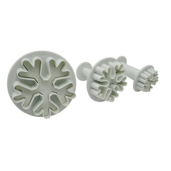 Set of 3 snowflake shaped fondant plunger cutters on a white background