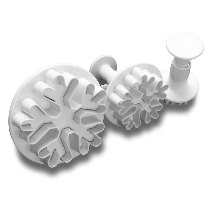 Set of 3 snowflake shaped fondant plunger cutters on a white background