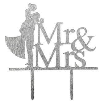 Decorative cake topper with 'Mr & Mrs' text and silhouettes of a couple on a white background.