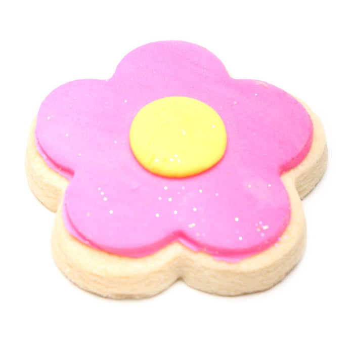 Flower-shaped cookie with pink frosting and yellow center on a white background
