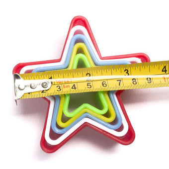 Set of colorful star-shaped measuring tools with a tape measure on a white background