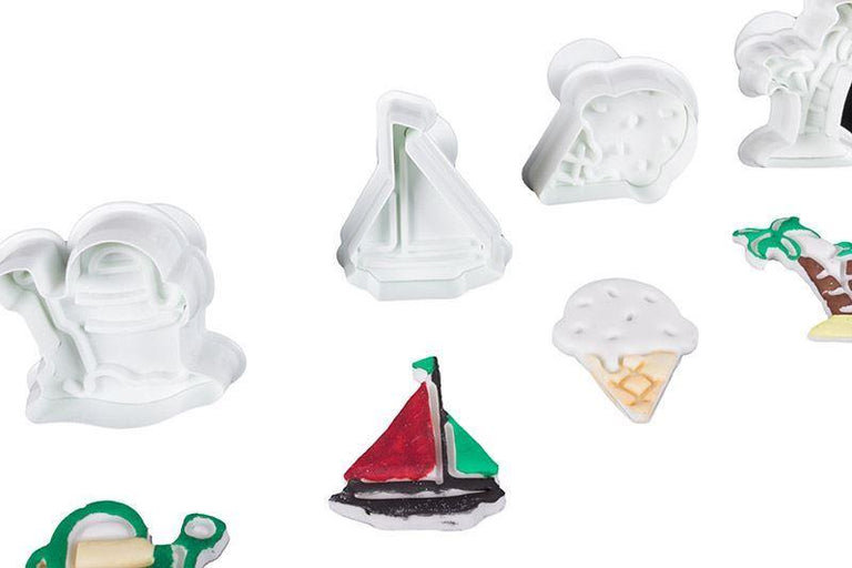 Collection of various plunger cutters on a white background