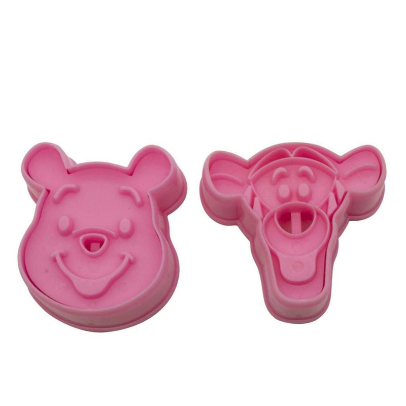 Two pink plunger cutters on a white background