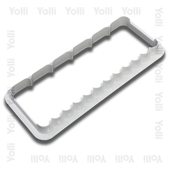 White plastic wavy and ribbed edge cutter on a white background
