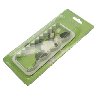 White plastic fondant edging cutter in packaging on a white background