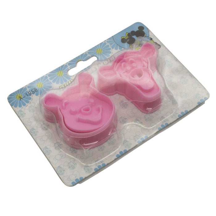 Pink  winnie and tigger fondant plunger cutter on a clear plastic card with blue decorative elements.